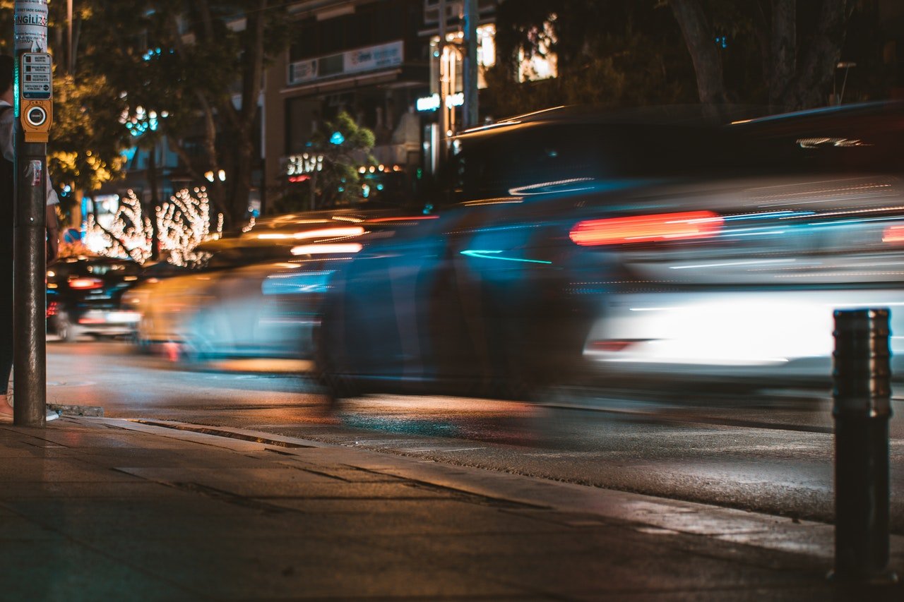 time-lapse-photography-of-silver-car-passed-by-on-road-763834