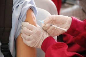 a person getting vaccinated after injury, medical malpractice